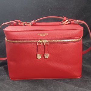Henri Bendel Saffiano Leather Train Case for cosmetics and travel in iconic red.
